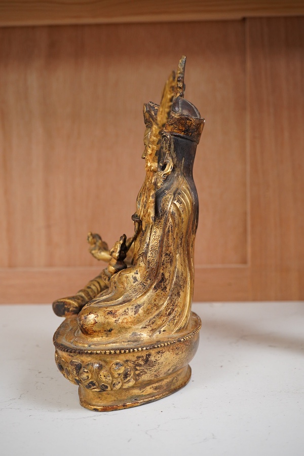 A gilt bronze figure of Padmasambhava, 22cm